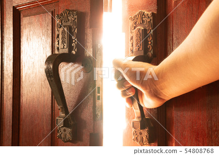 Hand open door light concept 54808768