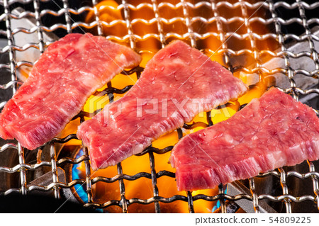 Baking meat at a yakiniku restaurant 54809225