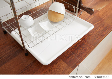 Kitchen with various kitchen tools, kitchen lathe and plants background. Dry dish and bowl shaped. Kitchen with various kitchen tools, kitchen lathe and plants background. Dry dish and bowl shaped. 54809658