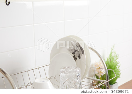 Kitchen with various kitchen tools, kitchen lathe and plants background. Dry dish and bowl shaped. Kitchen with various kitchen tools, kitchen lathe and plants background. Dry dish and bowl shaped. 54809671