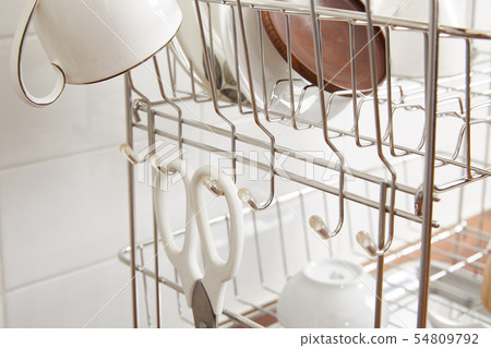 Kitchen with various kitchen tools, kitchen lathe and plants background. Dry dish and bowl shaped. Kitchen with various kitchen tools, kitchen lathe and plants background. Dry dish and bowl shaped. 54809792