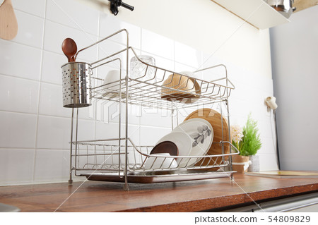Kitchen with various kitchen tools, kitchen lathe and plants background. Dry dish and bowl shaped. Kitchen with various kitchen tools, kitchen lathe and plants background. Dry dish and bowl shaped. 54809829