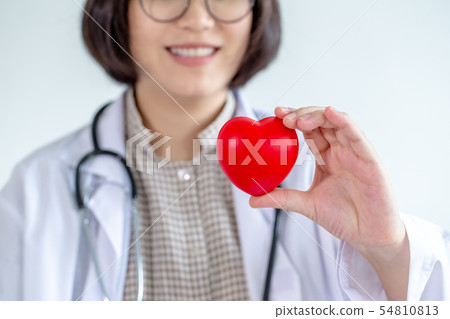 Asian woman doctor wearing glasses Hold your heart 54810813