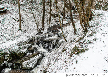 Winter landscape in the german mountains, snowy forest, trees in snow, winter creek, waterfall 54811194