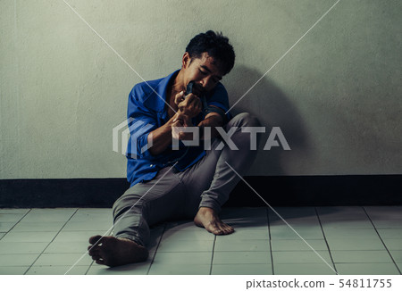 Asian man suffering from drugs. 54811755