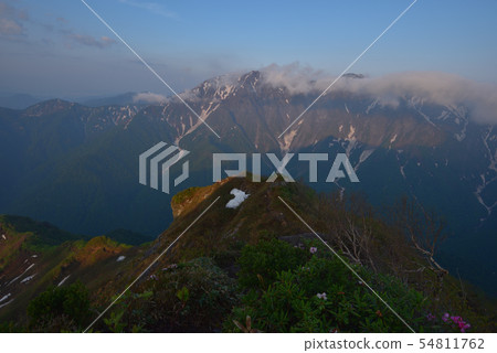Horseshoe-shaped Tanigawa-dake receiving the morning sun from the top of Hakumeno 54811762