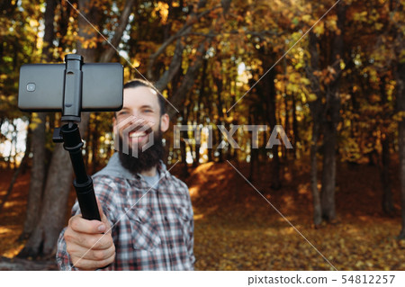 fall nature leisure man selfie autumn forest 54812257