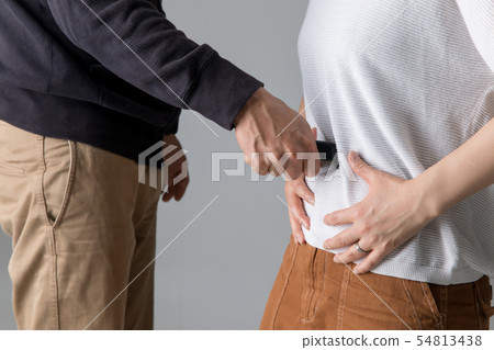 Men stabbing women - Stock Photo 54813438