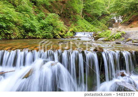 Picturesque and beautiful cascade waterfall Picturesque and beautiful cascade waterfall 54815377