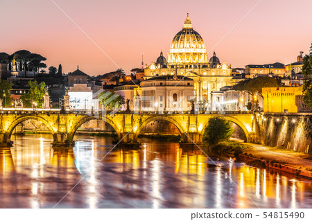 St Peters Basilica in Vatican and Ponte Sant'Angelo Bridge over Tiber River at dusk. Romantic 54815490
