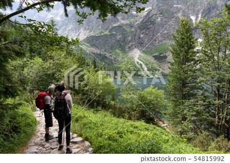 Young man and woman exploring road in the Young man and woman exploring road in the 54815992