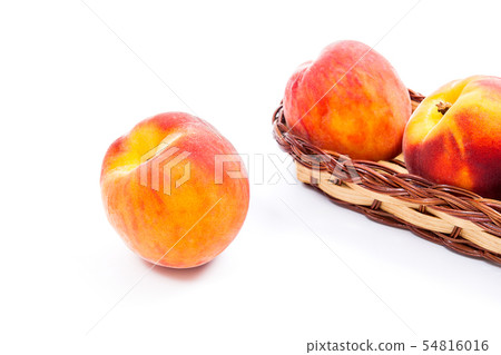 Single ripe peach fruit and several in basket 54816016