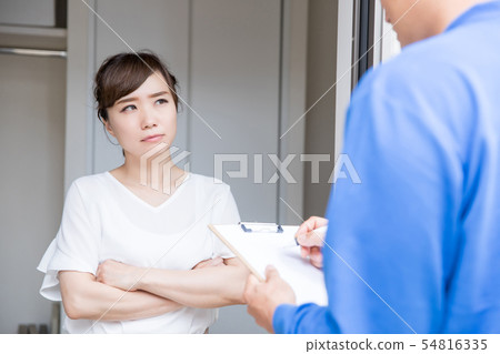 Housewife who is troubled by strangers visiting Housewife who is troubled by strangers visiting 54816335