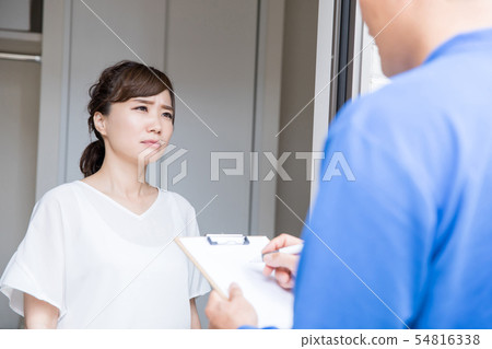 Housewife who is troubled by strangers visiting Housewife who is troubled by strangers visiting 54816338