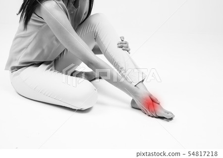 a woman has in injured foot a woman has in injured foot 54817218