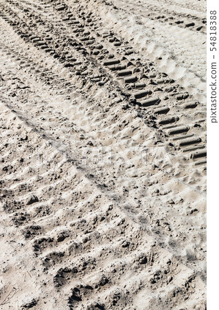 ground and sand and tracks left by tank, tractor or other ground and sand and tracks left by tank, tractor or other 54818388