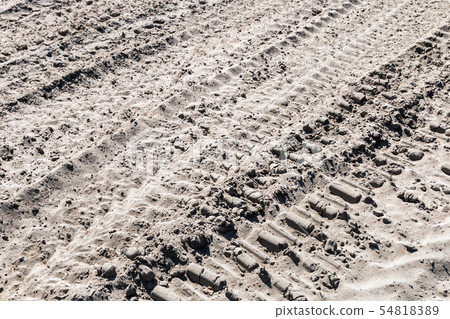 ground and sand and tracks left by tank, tractor or other ground and sand and tracks left by tank, tractor or other 54818389