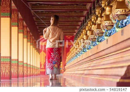 Rear view of young woman in Thai's temple Rear view of young woman in Thai's temple 54819147