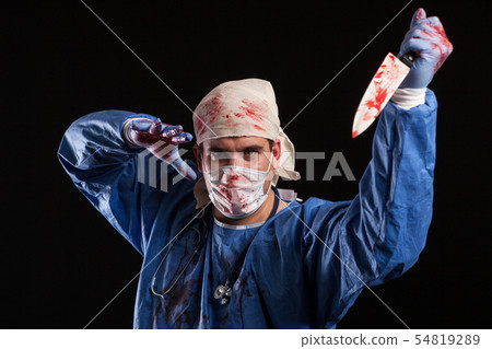 Young man dressed up like a doctor with schizophrenia for halloween carnival Young man dressed up like a doctor with schizophrenia for halloween carnival 54819289