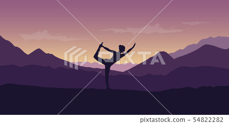 woman makes yoga pose at beautiful purple mountain nature landscape 54822282