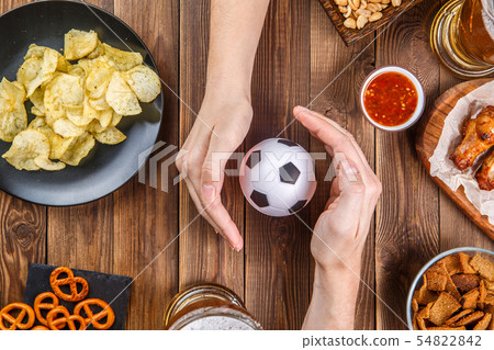 Snacks, hands with asoccer ball Snacks, hands with asoccer ball 54822842