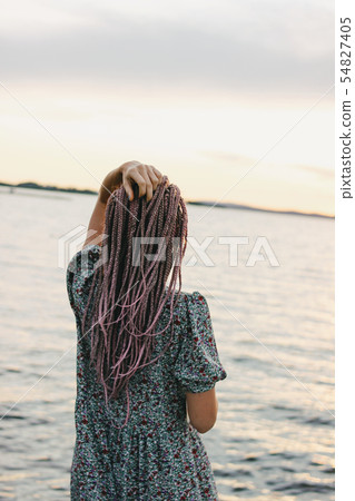 Beautiful romantic young woman with african braids 54827405