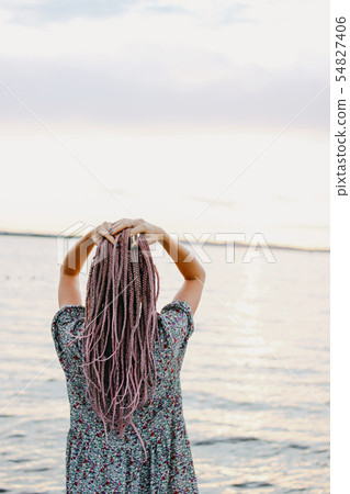 Beautiful romantic young woman with african braids 54827406