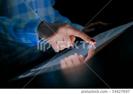 Woman using multimedia touchscreen display of interactive kiosk Woman using multimedia touchscreen display of interactive kiosk 54827697