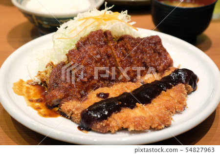 miso sauce top with tonkatsu on white dish miso sauce top with tonkatsu on white dish 54827963