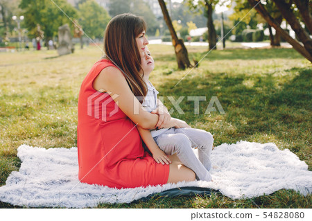 Mother with son playing in a summer park 54828080