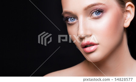 Fashion studio shot of beautiful young woman with make-up. Close-up portrait. Cosmmetology, beauty Fashion studio shot of beautiful young woman with make-up. Close-up portrait. Cosmmetology, beauty 54828577