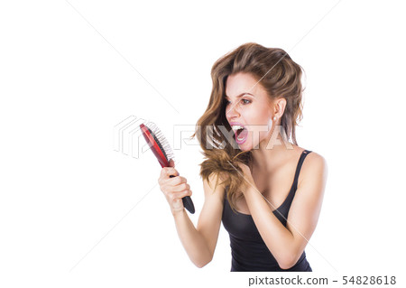 Young beautiful girl having problems while hair. Isolated studio shot 54828618