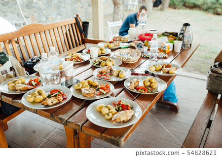 catering services background with snacks on guests table outdoor wedding party catering services background with snacks on guests table outdoor wedding party 54828621
