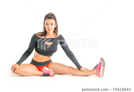 A Fitness woman stretching full body over white background A Fitness woman stretching full body over white background 54828643