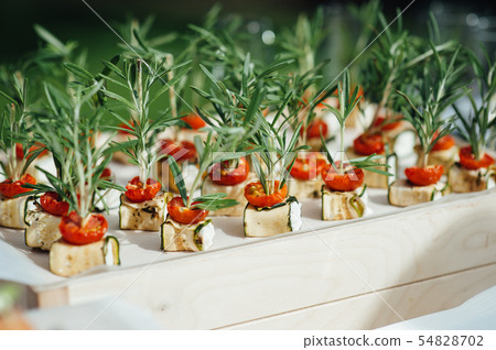 catering services background with snacks on guests table outdoor wedding party catering services background with snacks on guests table outdoor wedding party 54828702