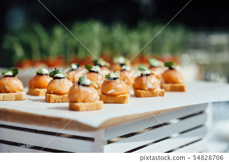 catering services background with snacks on guests table outdoor wedding party catering services background with snacks on guests table outdoor wedding party 54828706