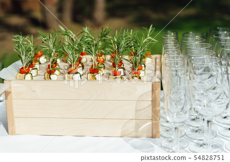 catering services background with snacks on guests table outdoor wedding party catering services background with snacks on guests table outdoor wedding party 54828751