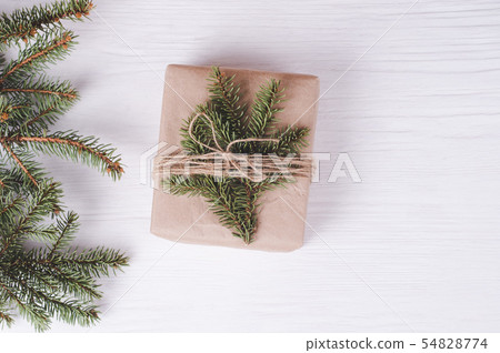 Christmas gift box on a white wooden background. Christmas gift box on a white wooden background. 54828774