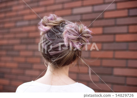 Hair styling rear view, brown pink color bun iroquois hairstyle on background. 54829726