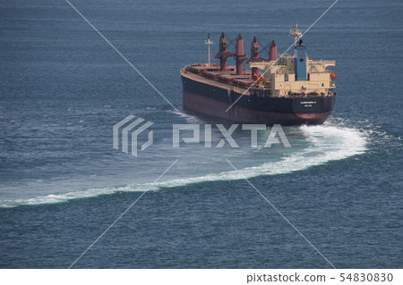 Cargo ship passing through Kurushima Strait 54830830