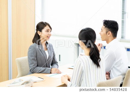 Young couple (consulting) Young couple (consulting) 54835428