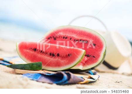 Summer picnic time on a beach. Fresh water melon 54835460