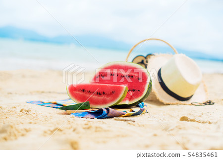 Summer picnic time on a beach. Fresh water melon 54835461