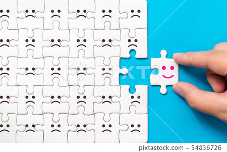 Hand of a businessman chooses a smiley face 54836726