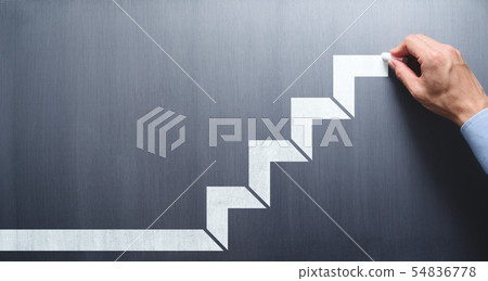 Image of steps to success. Male hand drawing stairs on blackboard. Image of steps to success. Male hand drawing stairs on blackboard. 54836778