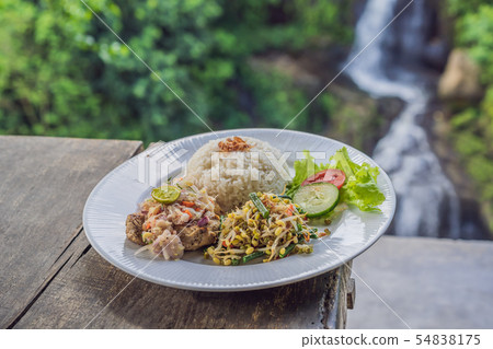 Indonesian food, tuna and rice in a cafe on the background of a waterfall 54838175