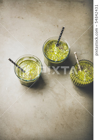 Vegan green smoothies in glasses with chia seeds 54842431