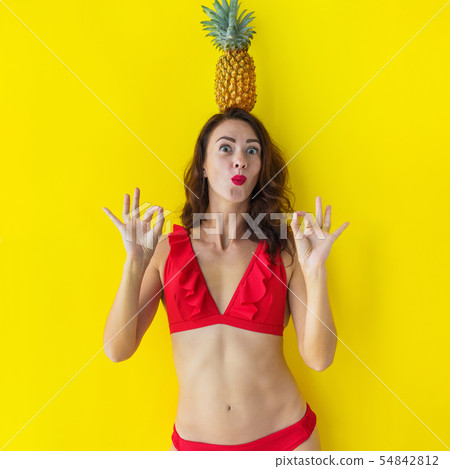 Young brunette woman in red bathing suit have fun Young brunette woman in red bathing suit have fun 54842812