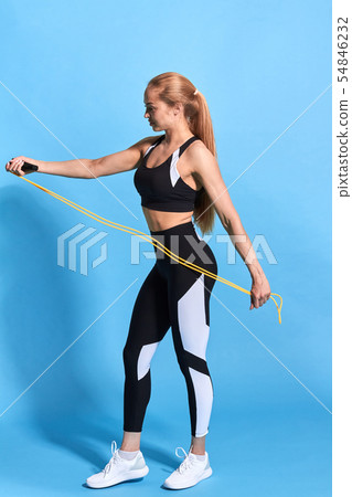 young personal trainer preparing a rope for workout 54846232