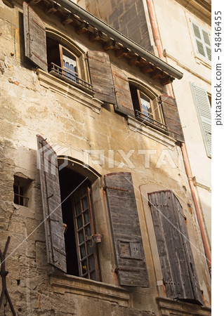 Historic house. Windows with wooden shutters. Historic house. Windows with wooden shutters. 54846455